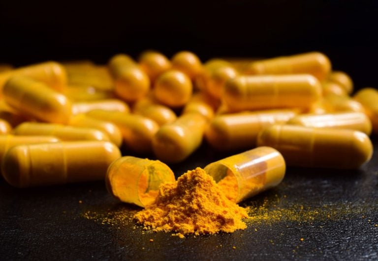A broken curcumin supplement capsule
